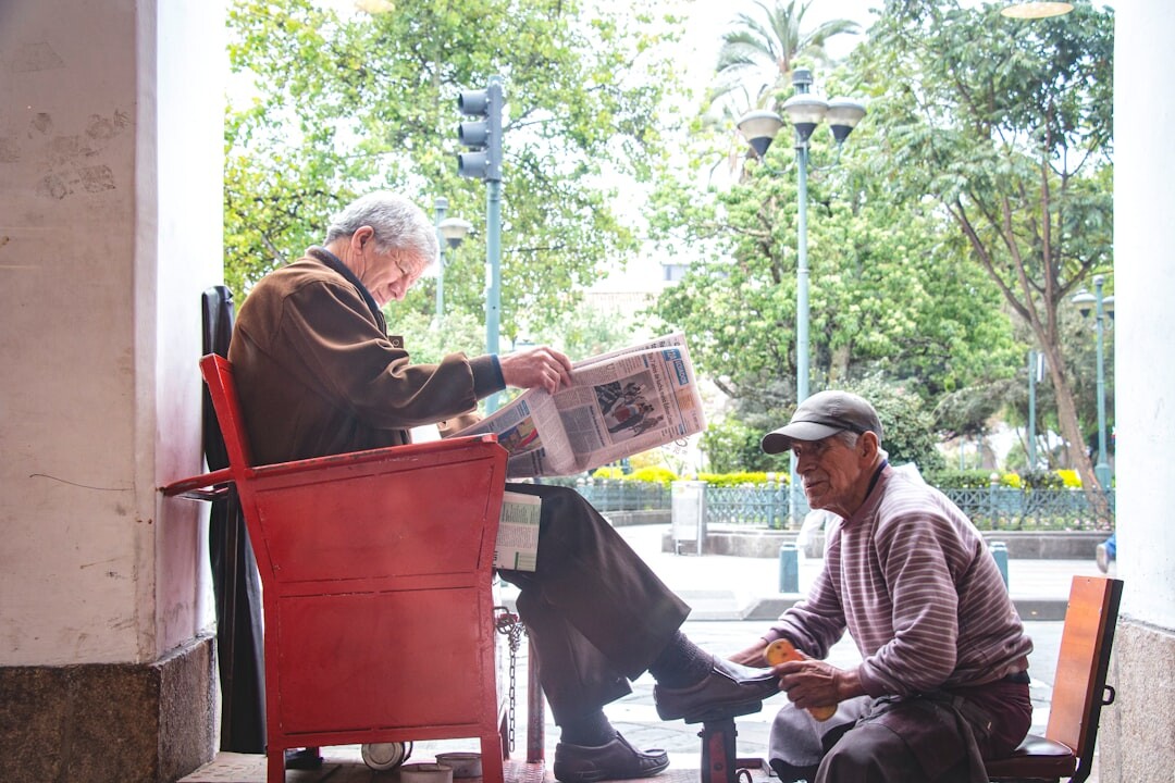 Friendly advisor helping a Croatian senior woman with paperwork