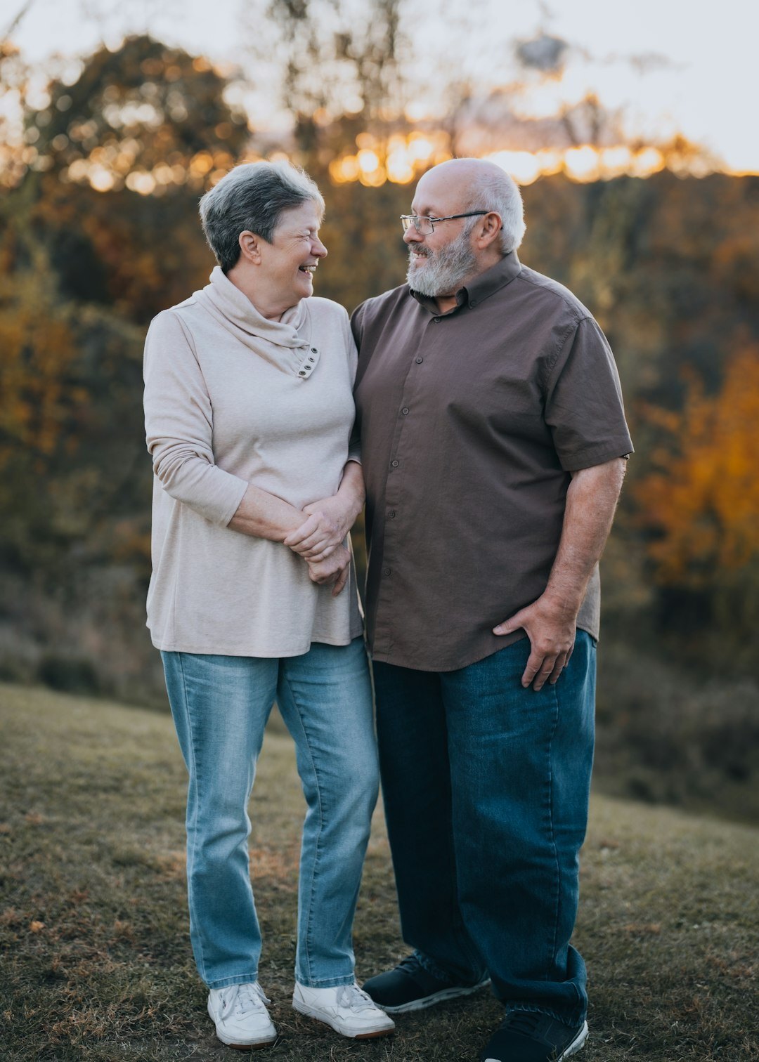 Smiling Croatian senior couple sitting together at home