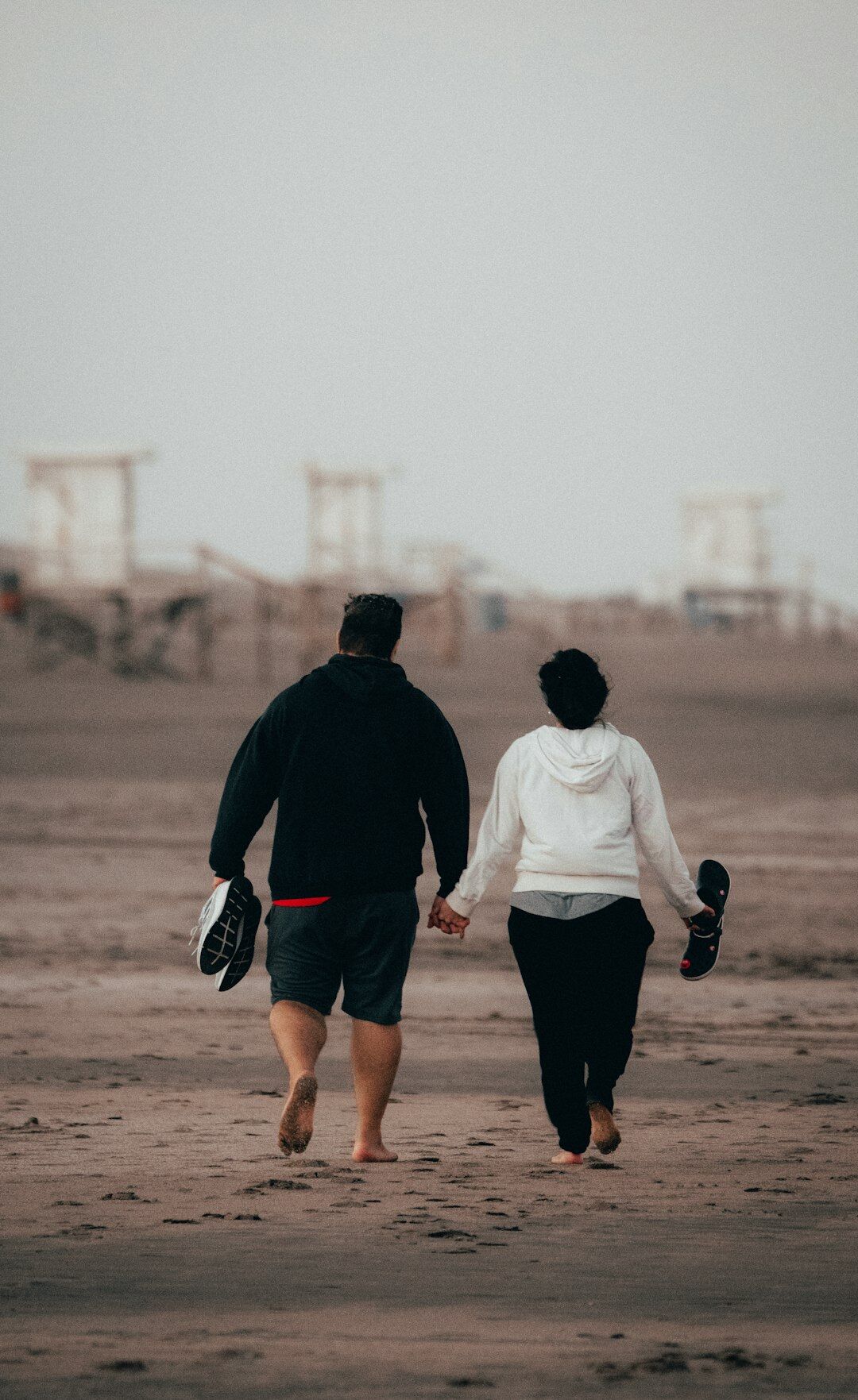 senior couple walking on beach