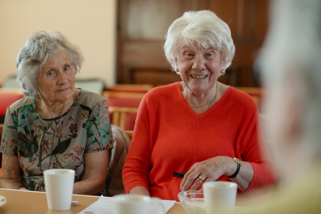 elderly people at community meeting