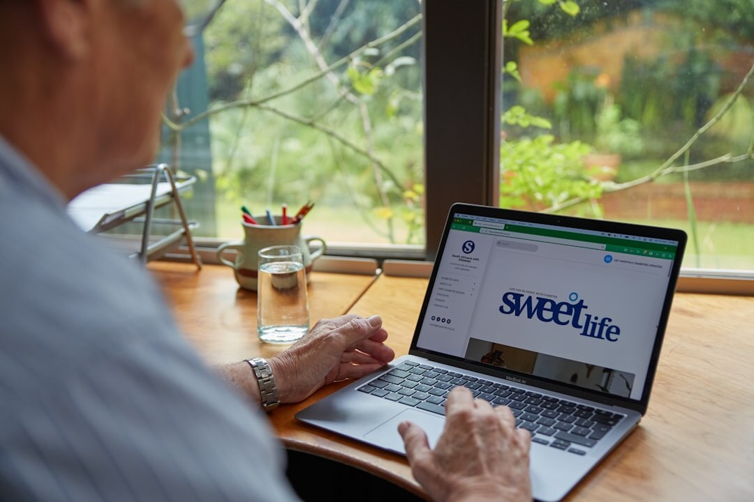 elderly person using laptop safely