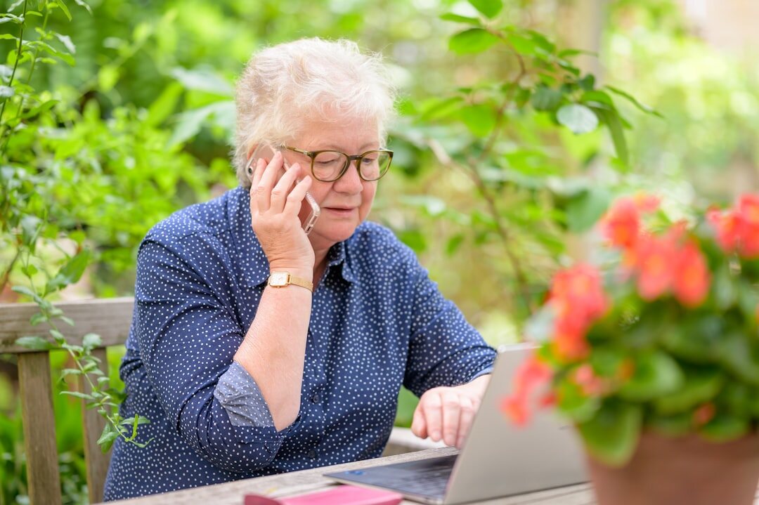 senior reading email carefully